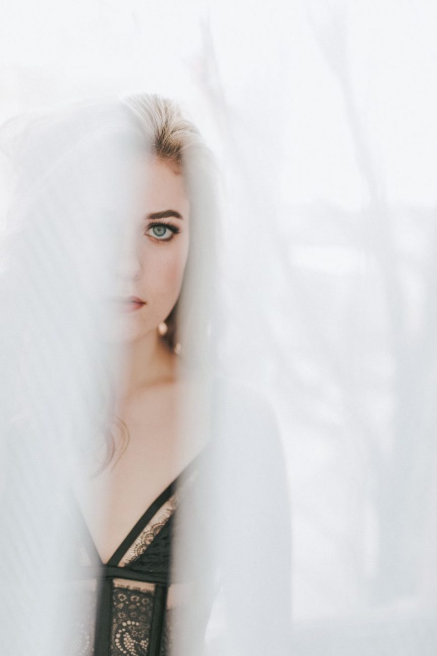 looking through curtains soft green eyes blonde