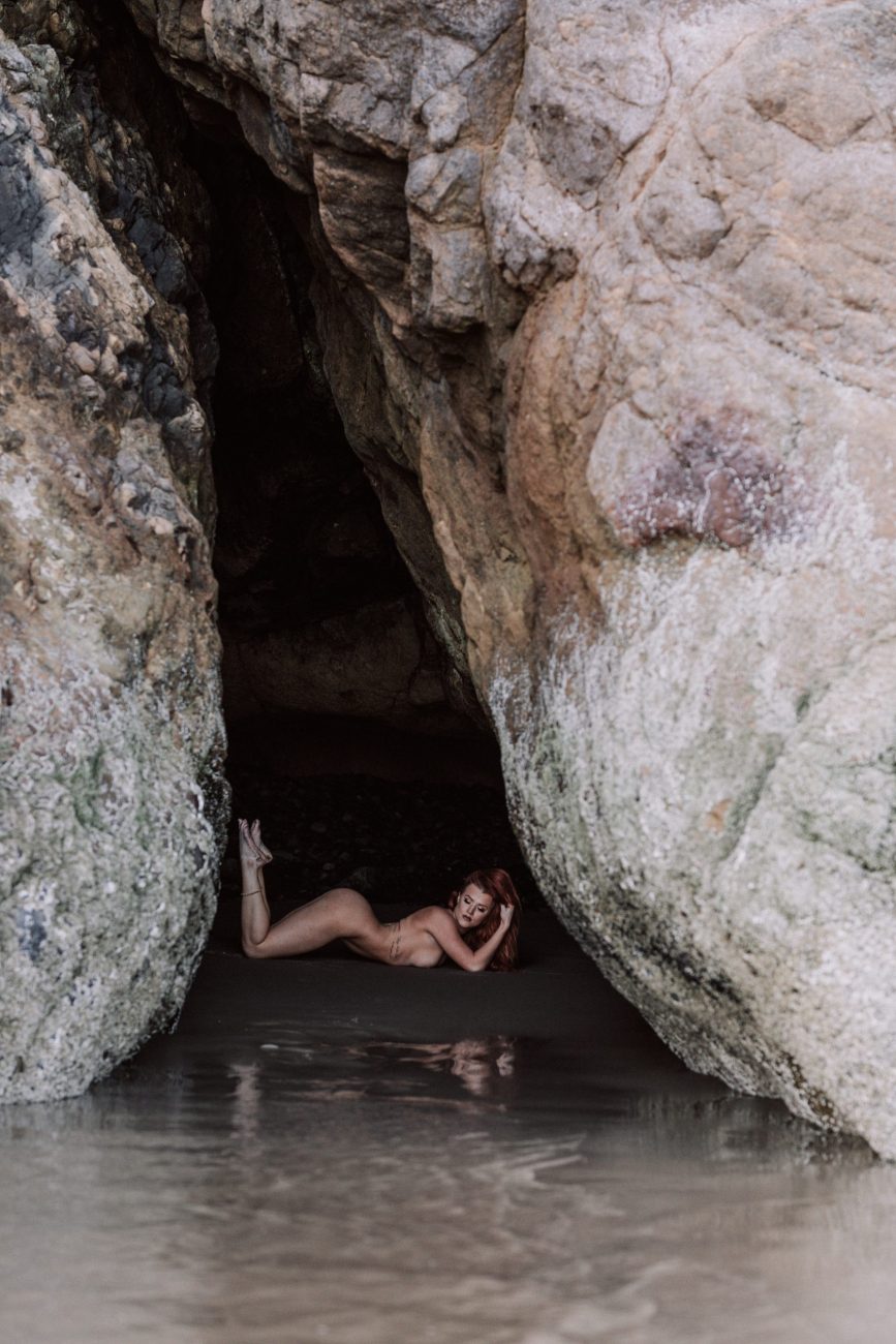 woman in cave naked redhead outdoor boudoir