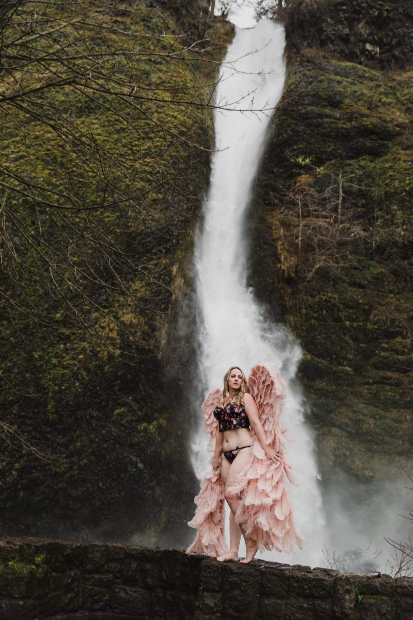 waterfall outdoor session woman wearing lingerie and wings standing