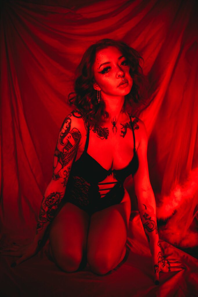 red tones webcam girl neon photoshoot suicide girl